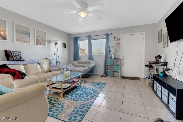 living room featuring ceiling fan and light tile patterned flooring