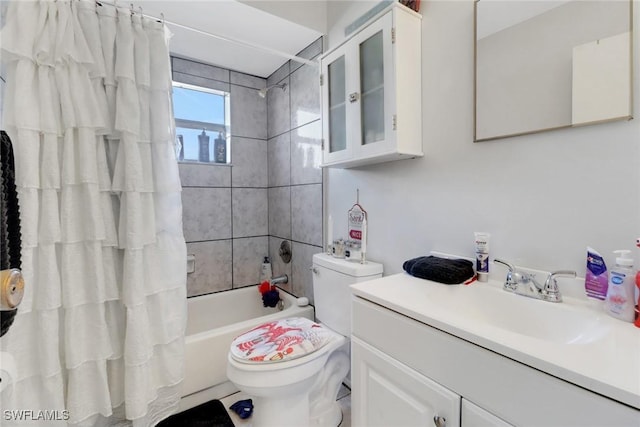 full bathroom with vanity, toilet, and shower / tub combo