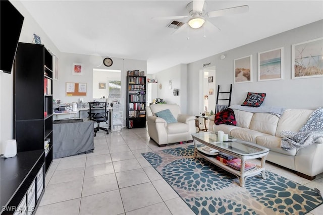 living room featuring light tile patterned floors and ceiling fan