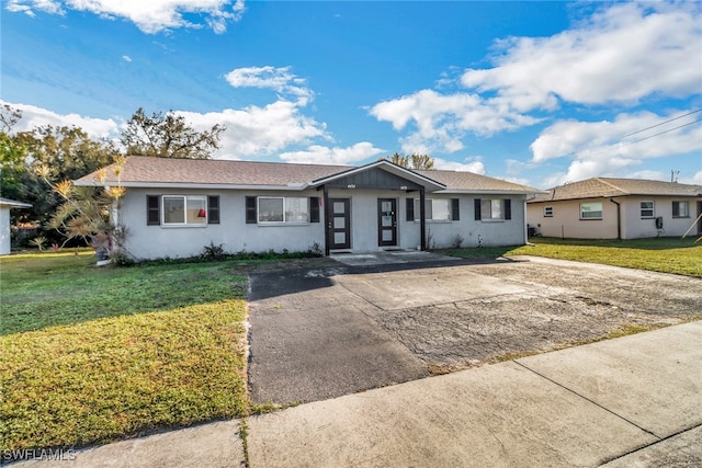 ranch-style house with a front yard