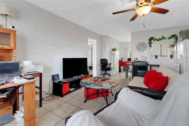 tiled living room featuring ceiling fan