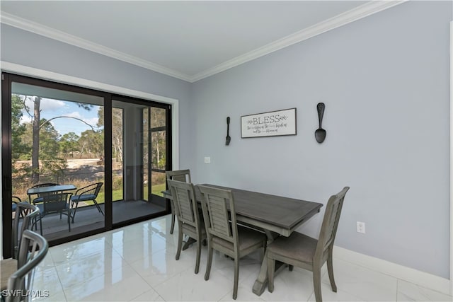 dining space featuring ornamental molding