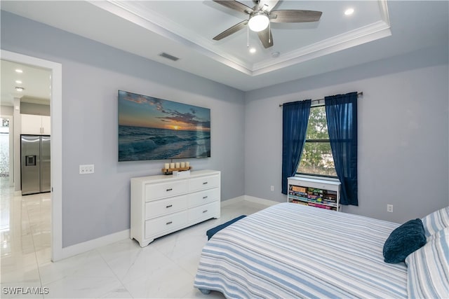 bedroom with ceiling fan, ornamental molding, a tray ceiling, and stainless steel fridge