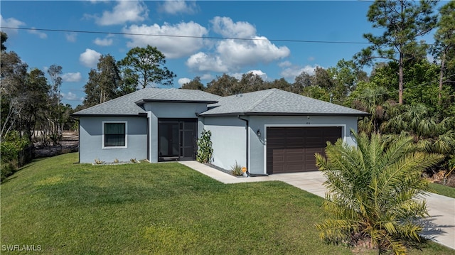 view of front of house featuring a garage and a front yard