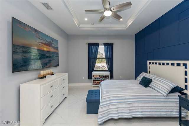 bedroom with ceiling fan, ornamental molding, and a raised ceiling