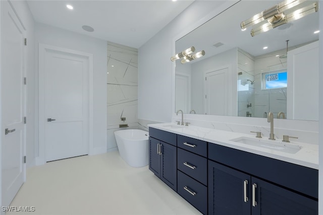 bathroom with vanity and independent shower and bath