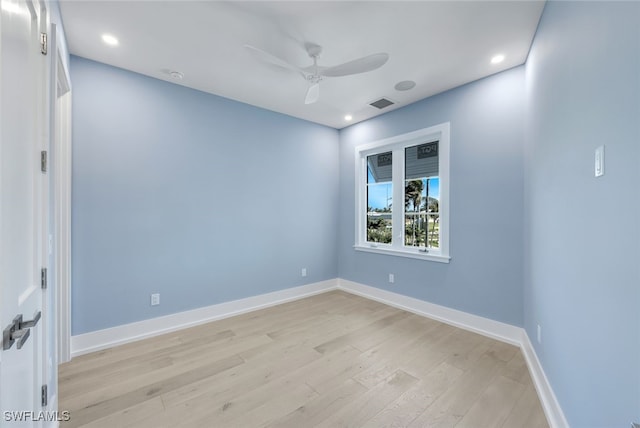 spare room featuring ceiling fan and light wood-type flooring