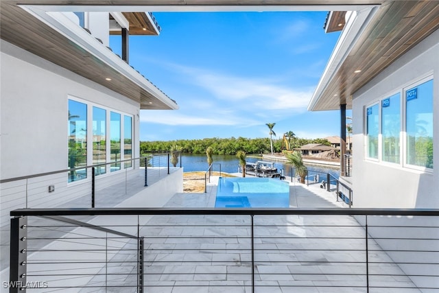 view of pool featuring a water view