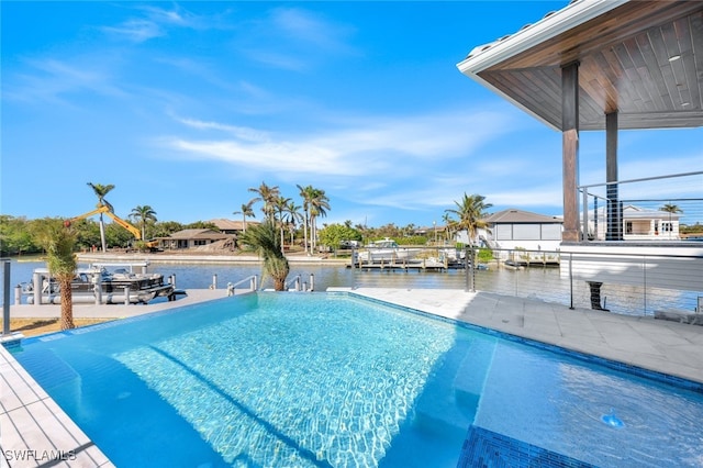 view of swimming pool featuring a water view and a boat dock