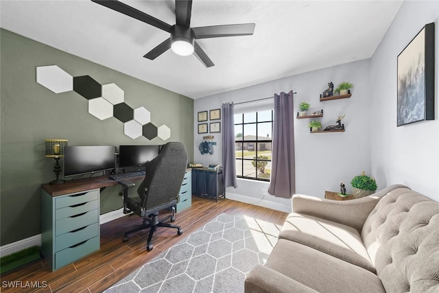 office space with ceiling fan and dark hardwood / wood-style flooring