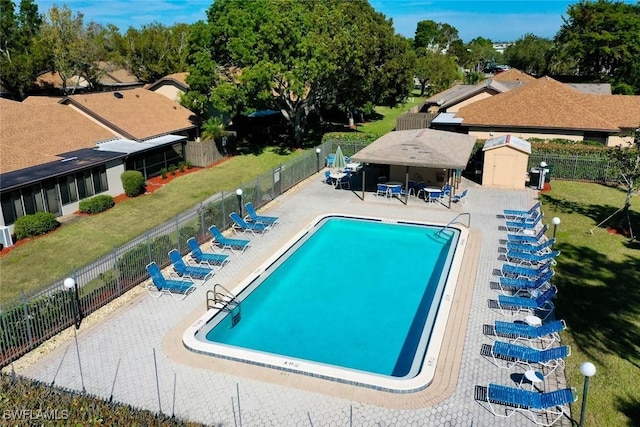 view of pool with a yard, a gazebo, and a patio area