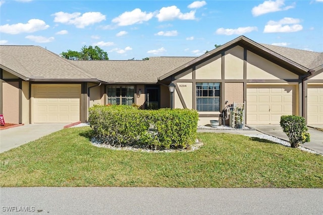 view of front of home featuring a garage and a front lawn