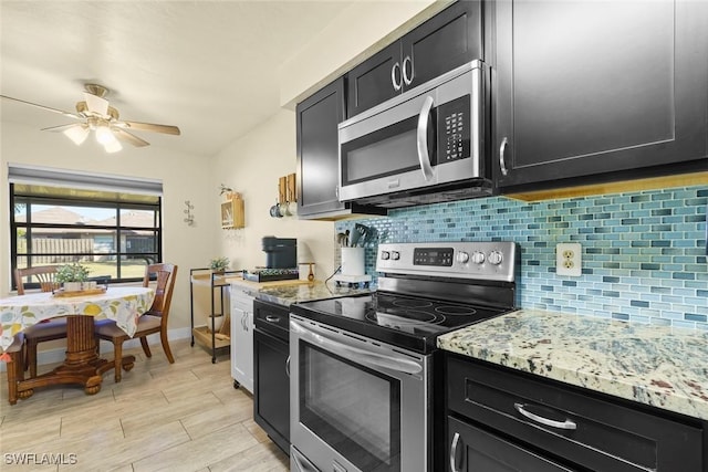 kitchen with light stone countertops, decorative backsplash, stainless steel appliances, and ceiling fan