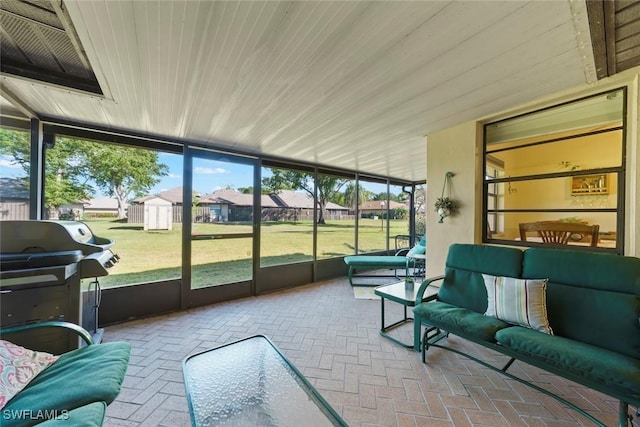 sunroom / solarium featuring wooden ceiling