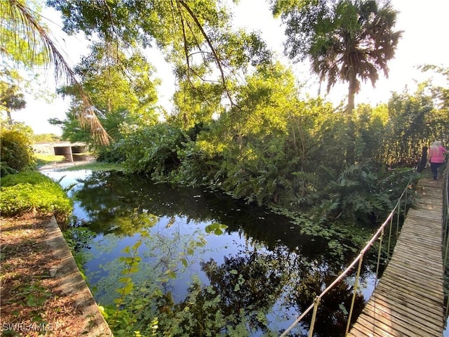 view of dock with a water view