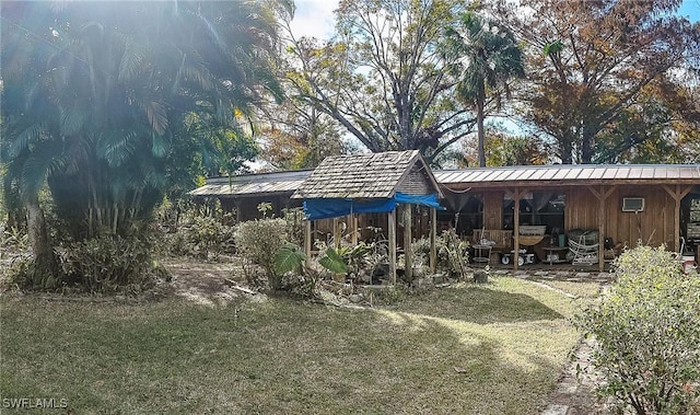 back of house featuring a yard