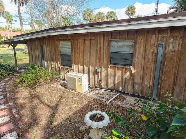 15323 E State Road 78, Okeechobee, FL 34974 - exterior space featuring ac unit and board and batten siding