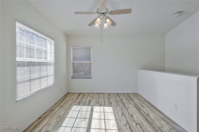 unfurnished room featuring ceiling fan and light hardwood / wood-style flooring