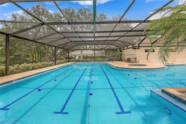 view of pool featuring a lanai and a patio