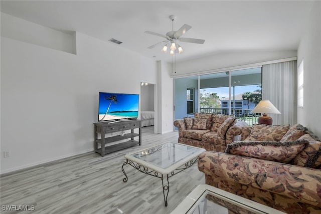 living room featuring ceiling fan and light wood-type flooring