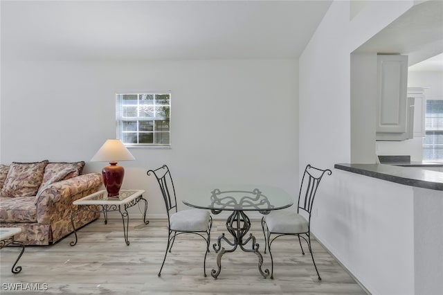 dining area featuring light wood-type flooring