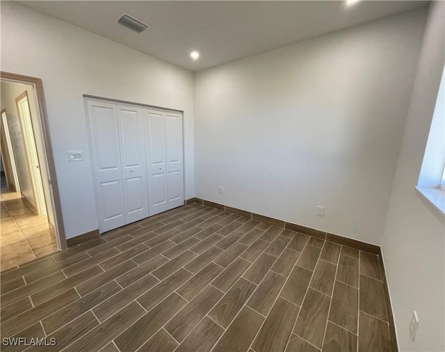 unfurnished bedroom with a closet