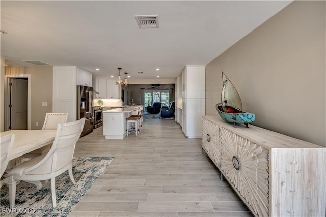 dining room featuring light hardwood / wood-style floors