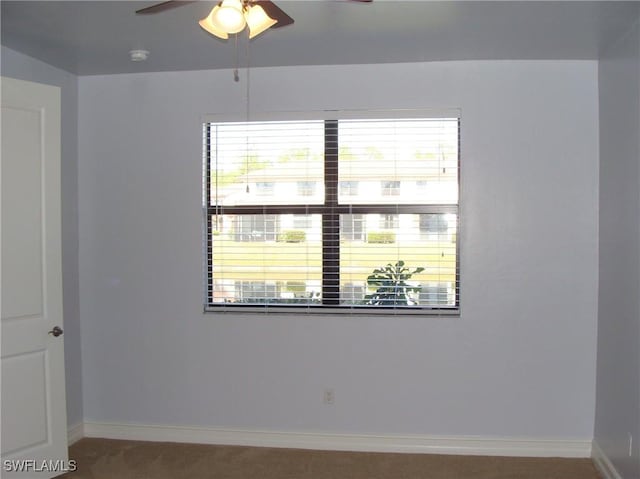 unfurnished room featuring ceiling fan and a healthy amount of sunlight