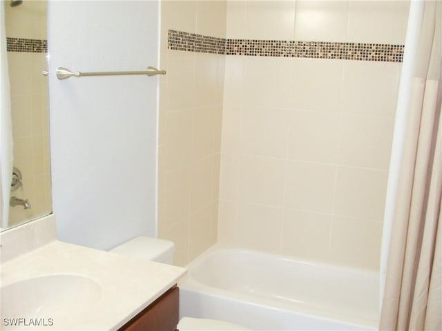 full bathroom with vanity, toilet, and shower / bath combo with shower curtain