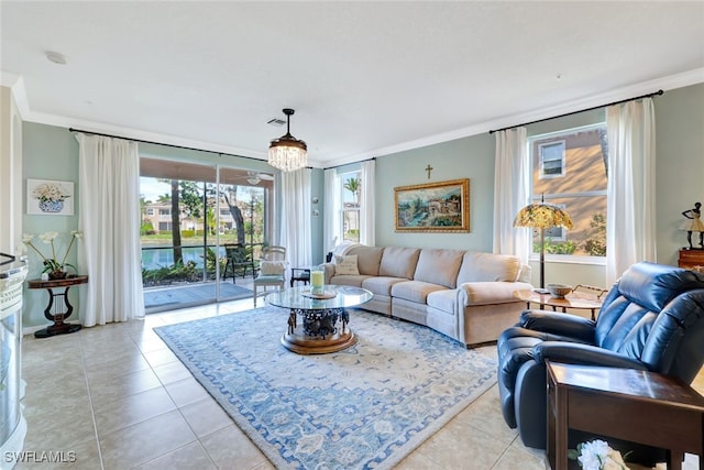 living room with crown molding and light tile patterned floors