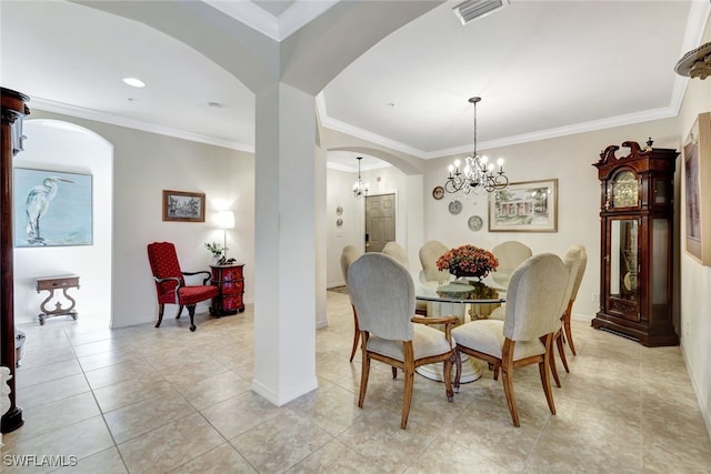 dining area with ornamental molding, a chandelier, and light tile patterned floors