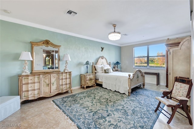 bedroom featuring ornamental molding and light tile patterned floors