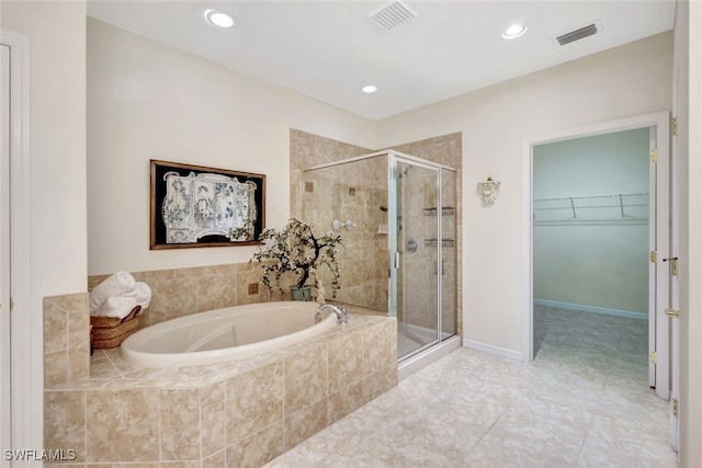 bathroom featuring separate shower and tub and tile patterned flooring