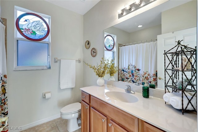 bathroom with toilet, vanity, tile patterned flooring, and a shower with curtain