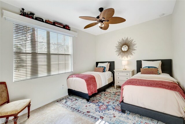 bedroom featuring ceiling fan and light tile patterned flooring