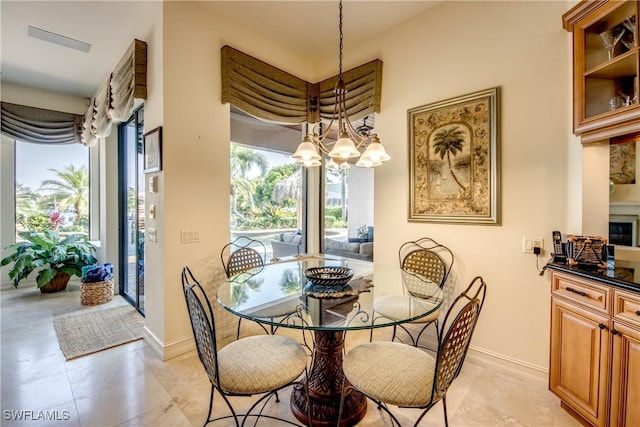 dining space featuring a notable chandelier