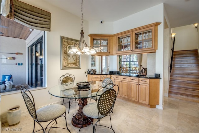 dining space featuring a notable chandelier