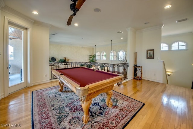 recreation room featuring crown molding, pool table, light hardwood / wood-style flooring, and a healthy amount of sunlight