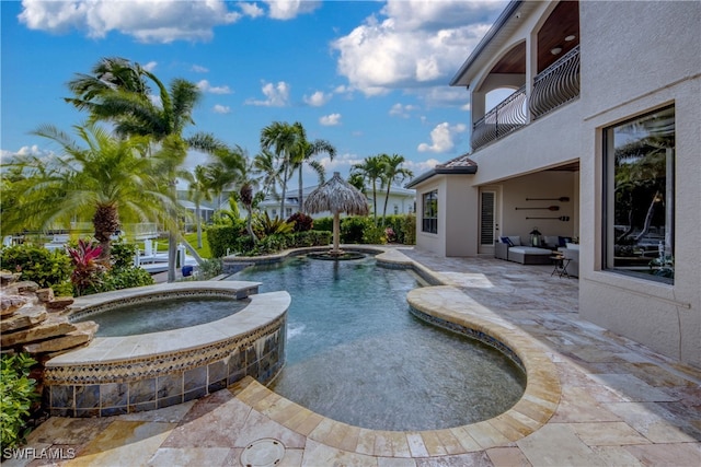 view of pool featuring an in ground hot tub and a patio area