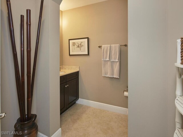 bathroom featuring tile patterned flooring and vanity