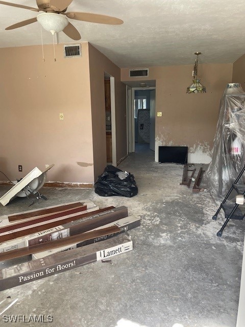 unfurnished living room featuring a textured ceiling