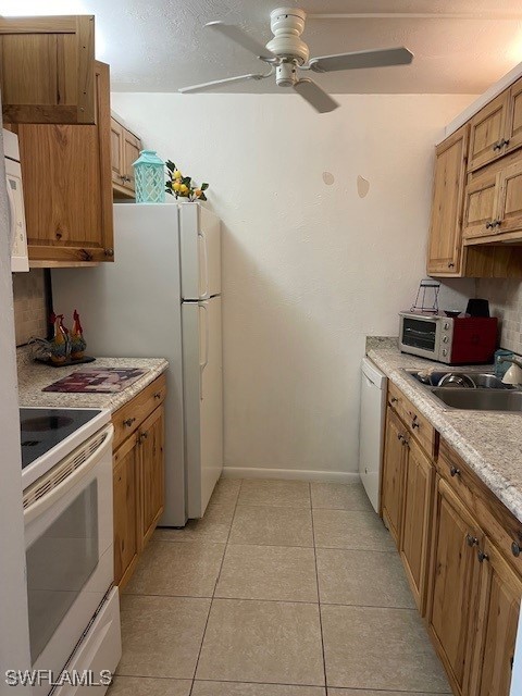 kitchen with ceiling fan, white appliances, sink, and light tile patterned floors