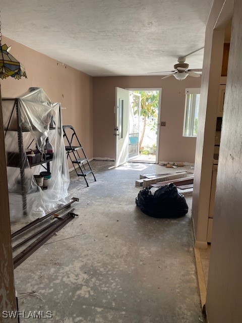 miscellaneous room with a textured ceiling