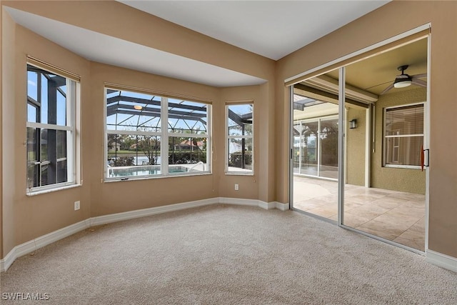 carpeted empty room with ceiling fan