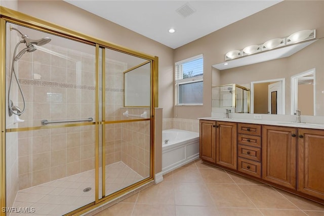 bathroom with tile patterned flooring, plus walk in shower, and vanity