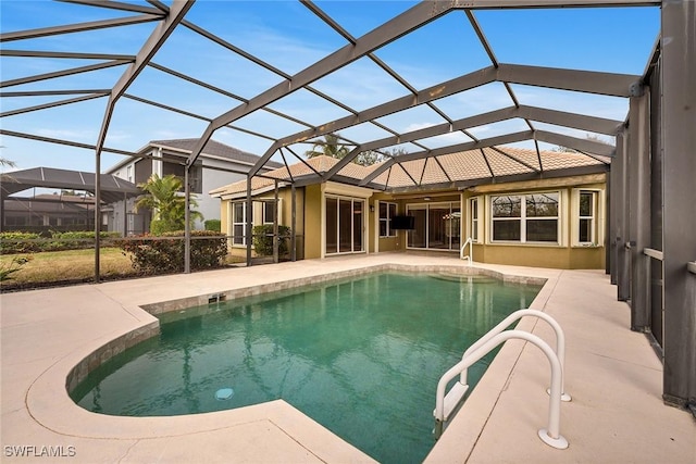 view of pool featuring a patio and glass enclosure