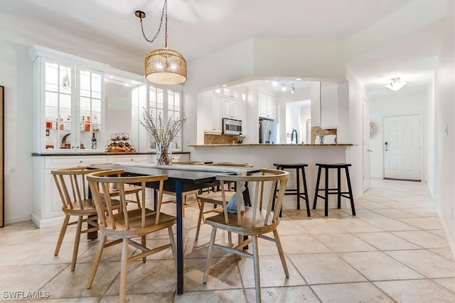 871 Tanbark Dr Unit 102, Naples, FL 34108 - dining area with light tile patterned floors