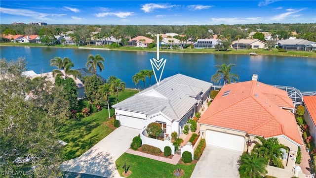 birds eye view of property featuring a water view