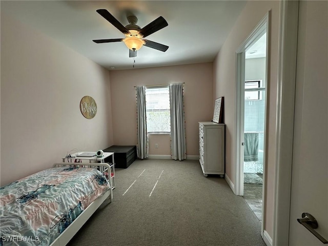 bedroom with light carpet, a ceiling fan, and baseboards