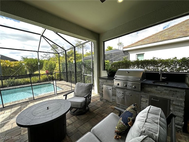 view of patio / terrace with grilling area, an outdoor kitchen, a sink, a lanai, and an outdoor pool